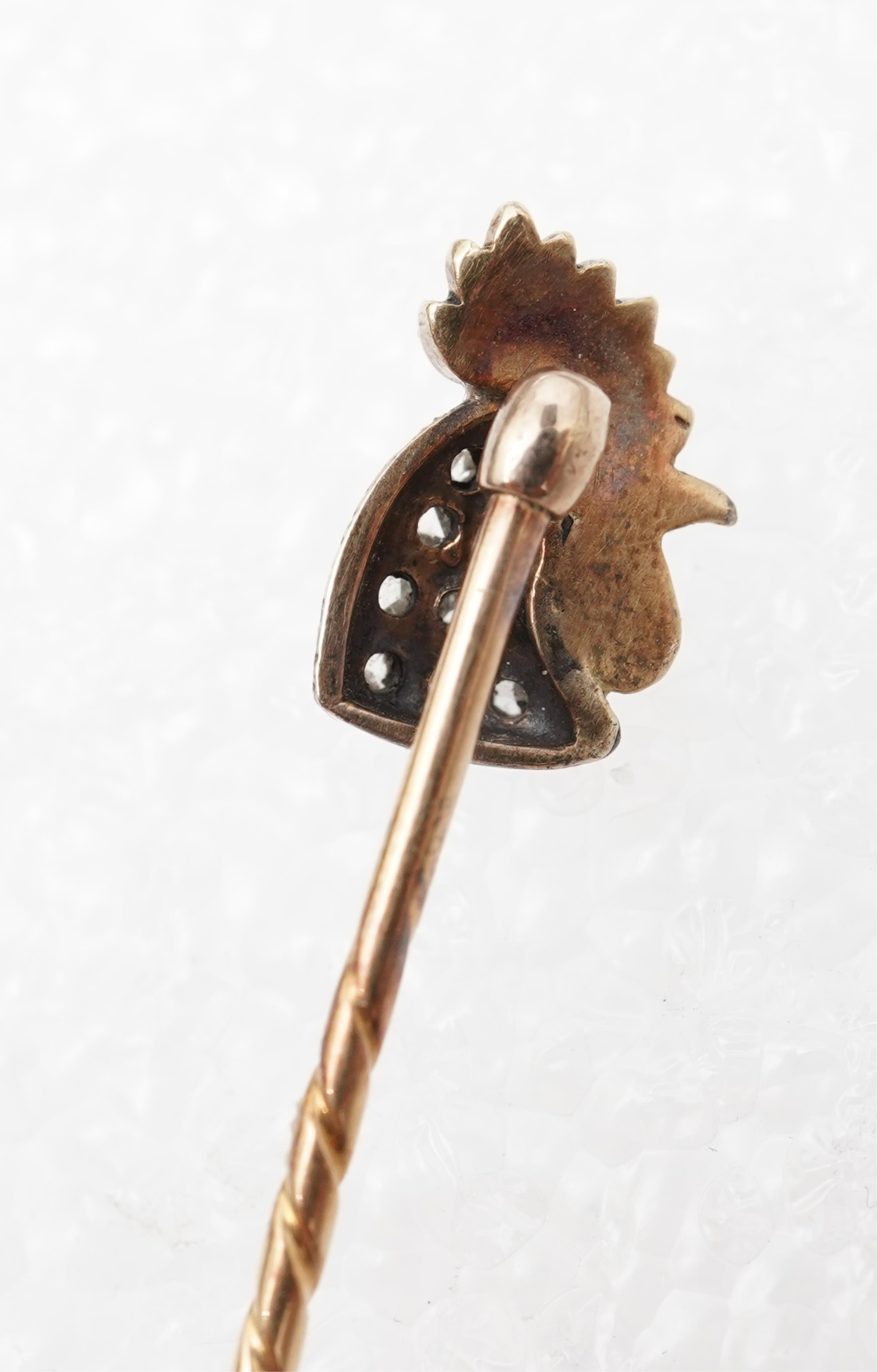 An enamel and diamond stick pin, circa 1900
